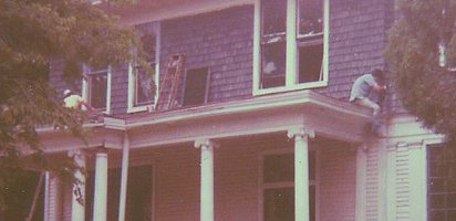 Charlie Perry and James Campbell (probably) scraping paint